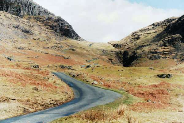 Hardknott Pass from Eskdale.  You can just see the road make its way down from the saddle between the hills.